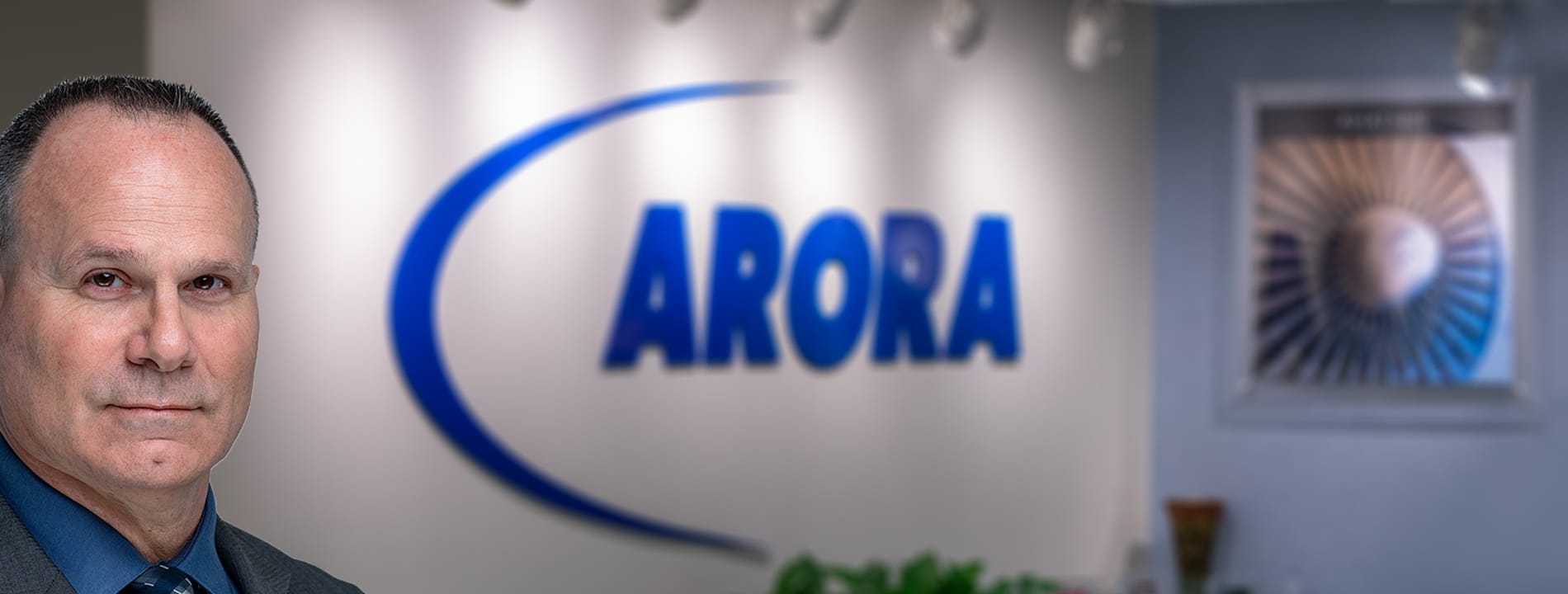 1900x720 Leadership Header (Arora Reception Area Sign Backdrop Vince AHMP